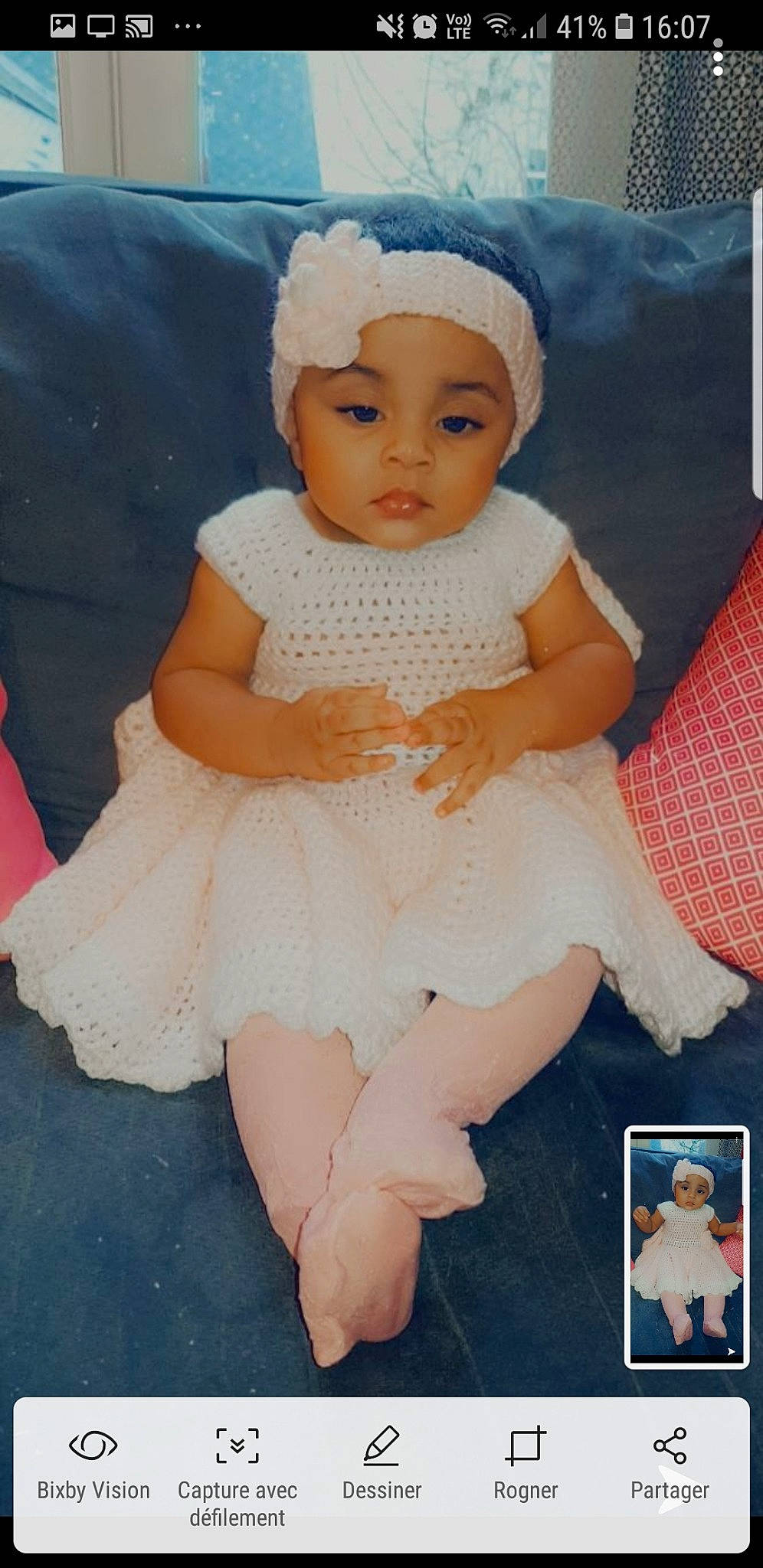 Nabila participe au concours pour gagner de l'argent avec cette photo : baby, baby_toddler_clothing, bonnet, child, costume_accessory, day_dress, dress, embellishment, hair_accessory, hand, headband, headgear, headpiece, headwear, one_piece_garment, peach, person, pink, sitting, skin