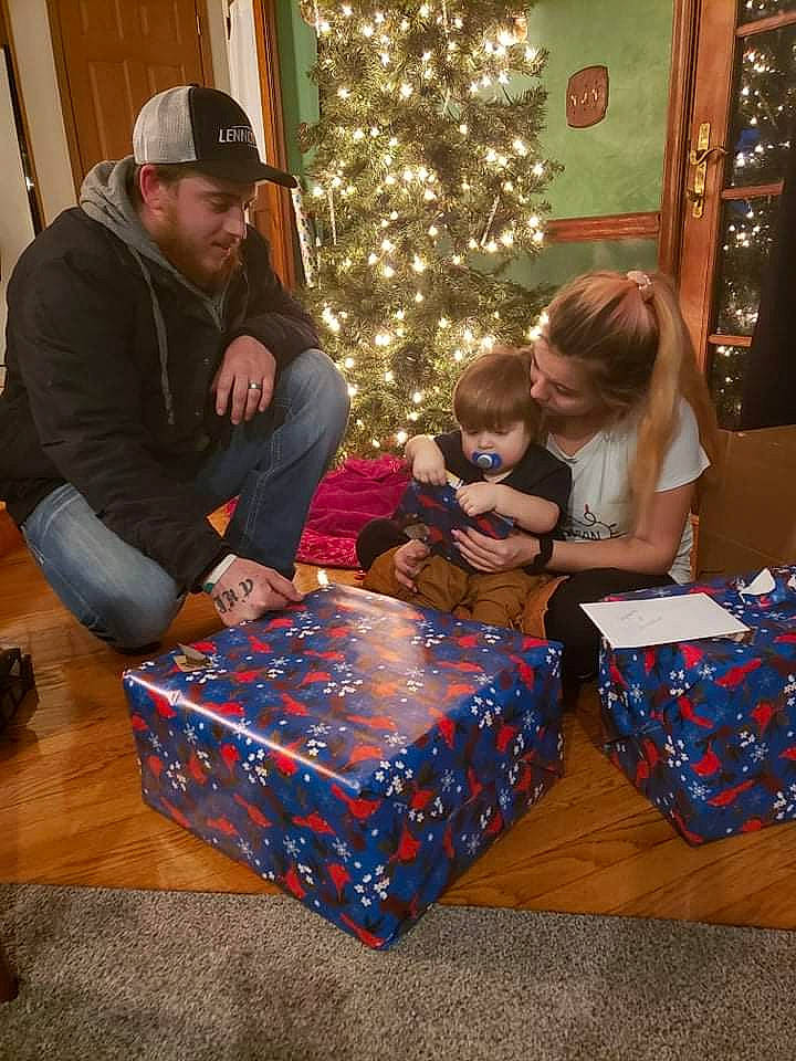 Dallas joined the competition — help win amazing prizes! child, christmas, christmas_decoration, christmas_eve, christmas_ornament, christmas_tree, event, fun, hat, head, headwear, holiday, holiday_ornament, lap, leisure, ornament, people, person, sitting, toddler