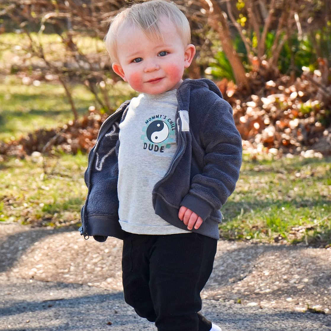Hunter joined the competition — help win amazing prizes! toddler, child, boy, outdoor, standing, jacket, socks, pathway, grass, leaves, smiling, face, blond_hair, casual_clothing, sunlight, nature, portrait, curious, rosy_cheeks, seasonal