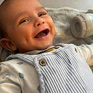 Aylan Louati participe au concours pour gagner de l'argent avec cette photo : baby, smiling, laughing, dimples, infant, clothing, overalls, blanket, bottle, happy, face, cute, child, portrait, indoors, soft, cozy, apparel, person, babywear
