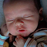 Aeson is registered to the contest to win money with this photo: baby, child, closeup, clothing, cozy, cute, face, hand, indoor, infant, newborn, newborn_clothes, peaceful, portrait, resting, skin, sleeping, soft_light, striped, tiny