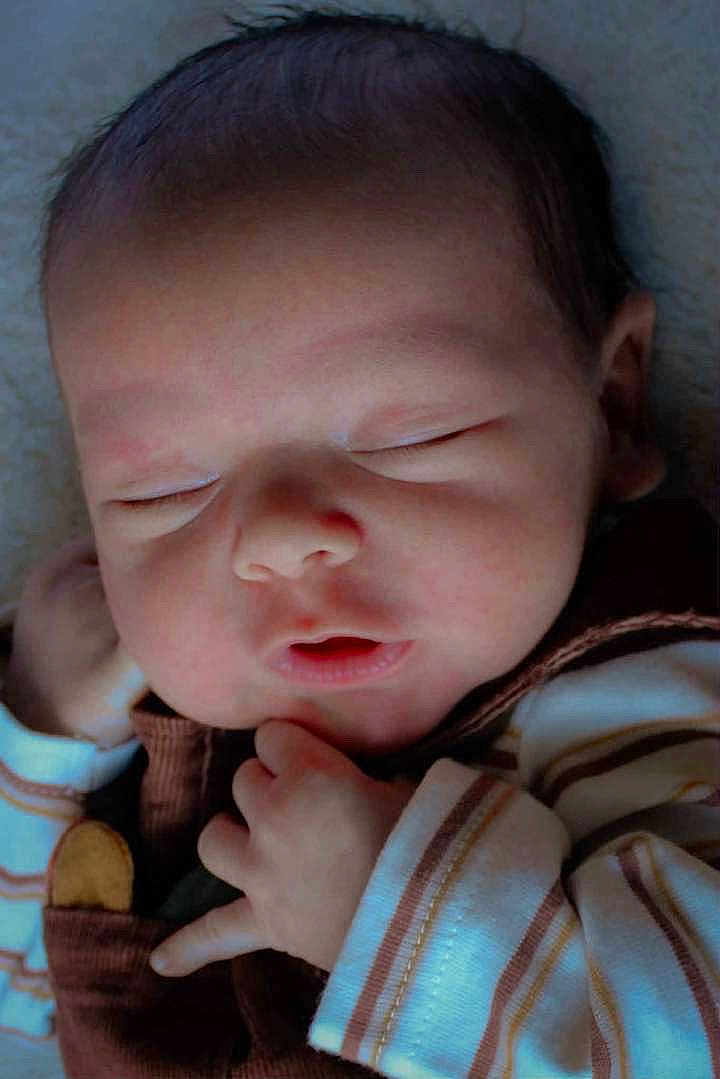 Aeson is registered to the contest to win money with this photo: baby, child, closeup, clothing, cozy, cute, face, hand, indoor, infant, newborn, newborn_clothes, peaceful, portrait, resting, skin, sleeping, soft_light, striped, tiny