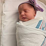 Fiona joined the competition — help win amazing prizes! newborn, baby, sleeping, swaddled, hospital, blanket, hat, bow, infant, bed, face, peaceful, cute, resting, portrait, person, closeup, soft, child, indoors