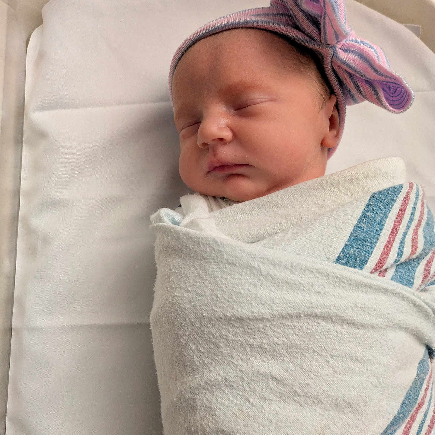 Fiona joined the competition — help win amazing prizes! newborn, baby, sleeping, swaddled, hospital, blanket, hat, bow, infant, bed, face, peaceful, cute, resting, portrait, person, closeup, soft, child, indoors