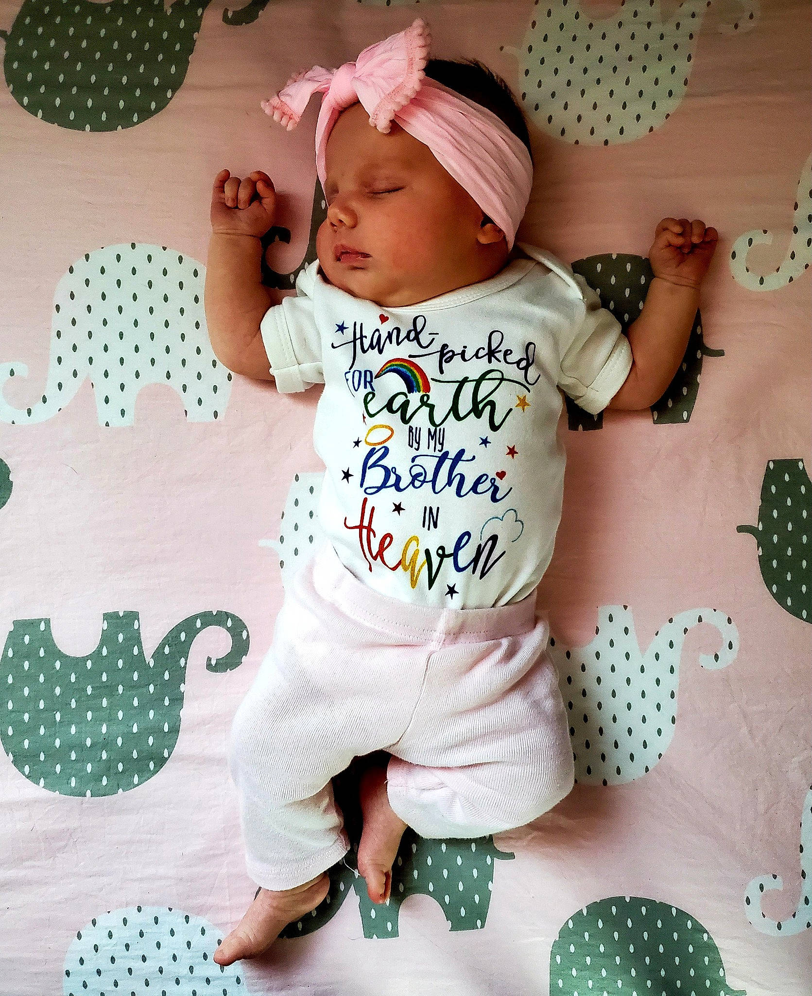 Phoebe is registered to the contest to win money with this photo: baby, baby_products, baby_toddler_clothing, child, headwear, pajamas, pattern, person, pink, play, product, sleeve, toddler