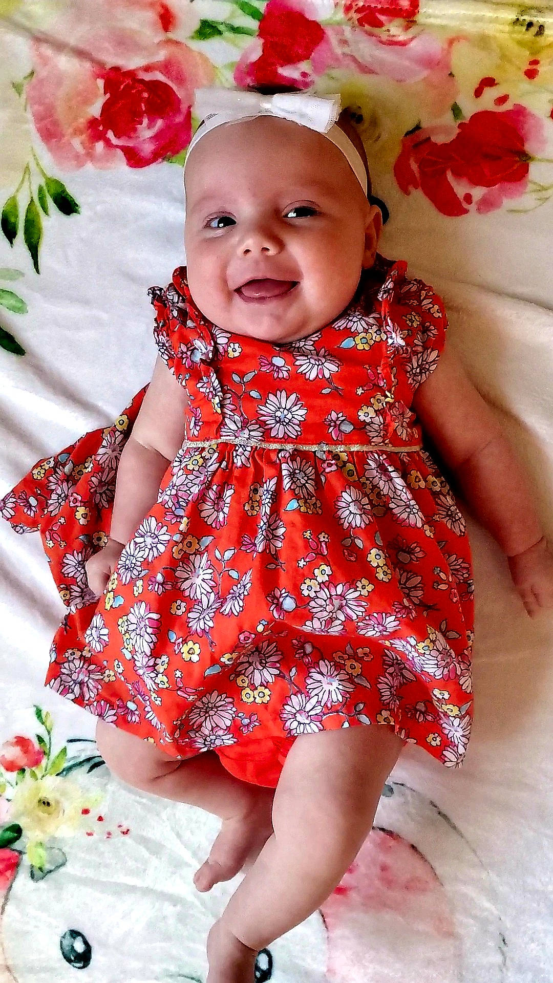 Phoebe joined the competition — help win amazing prizes! baby, baby_products, baby_toddler_clothing, cheek, child, child_model, clothing, dress, pattern, person, red, sitting, sleeve, smile, textile, toddler