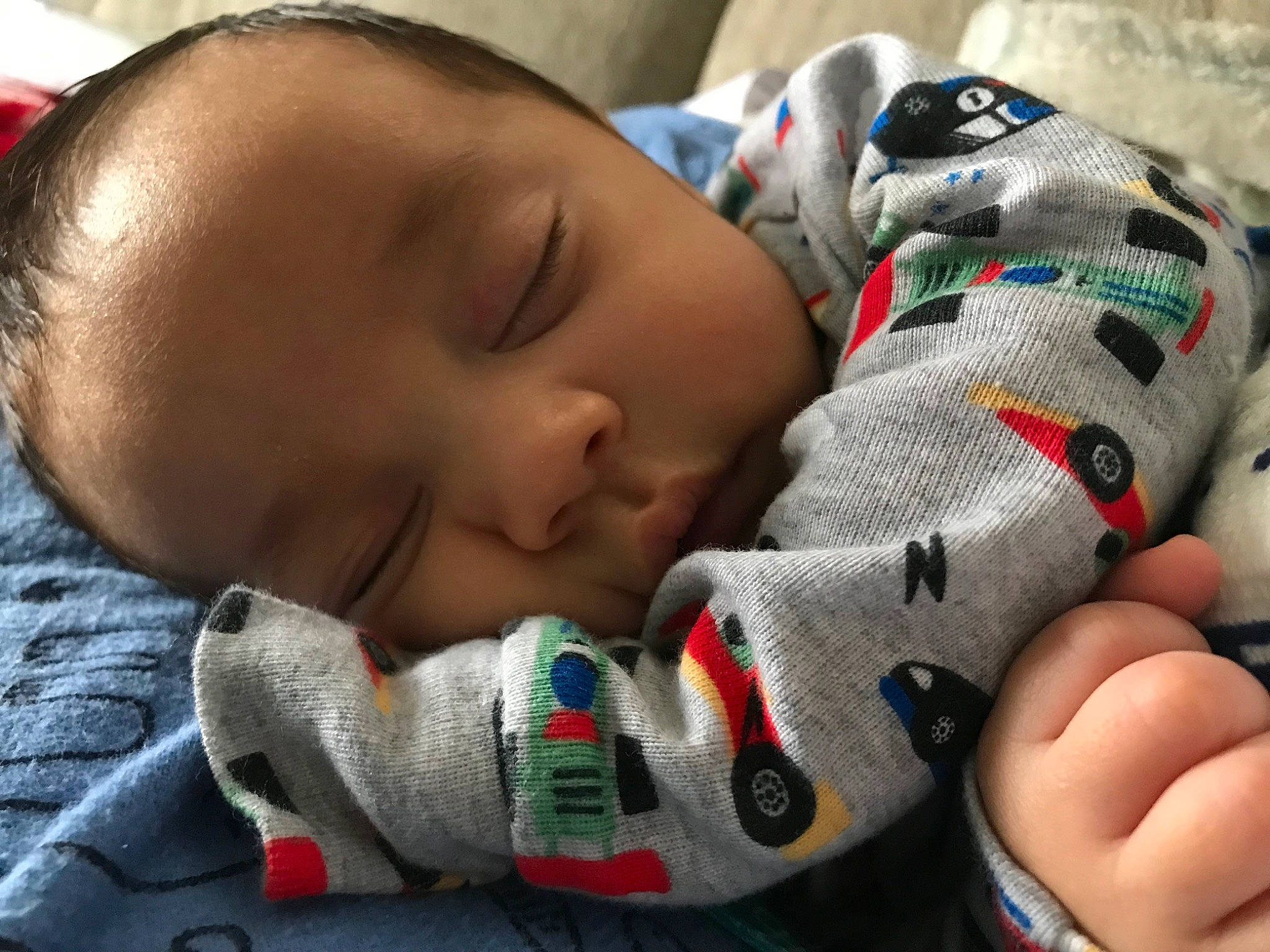 Maxwell is registered to the contest to win money with this photo: baby, baby_products, baby_sleeping, baby_toddler_clothing, cheek, child, comfort, facial_expression, finger, hand, linens, mammal, mouth, nail, nose, person, skin, textile, thumb, toddler
