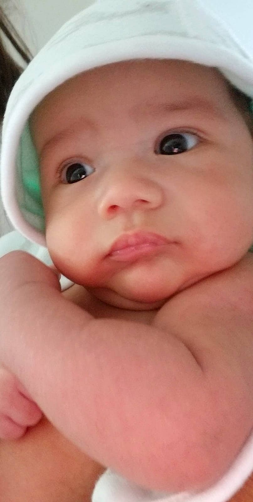 Derrek is registered to the contest to win money with this photo: cheek, child, chin, close_up, face, finger, hand, headwear, infant, iris, lip, nose, person, skin, toddler