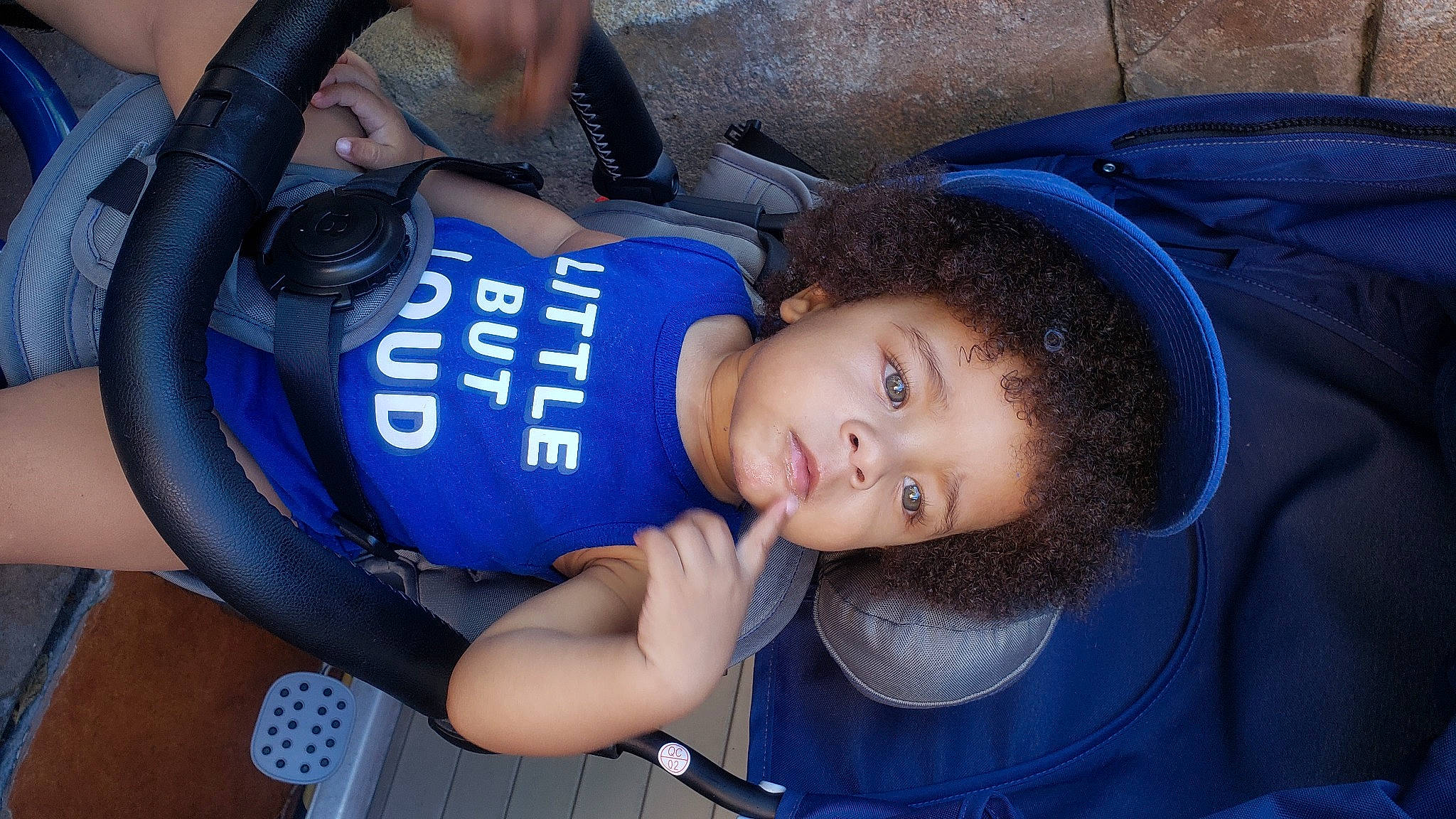 Sequan Quaziek is registered to the contest to win money with this photo: arm, auto_part, baby_carriage, baby_products, baby_toddler_clothing, car_seat, child, comfort, cool, electric_blue, fun, hand, hat, leisure, organ, person, plant, recreation, snapshot, toddler