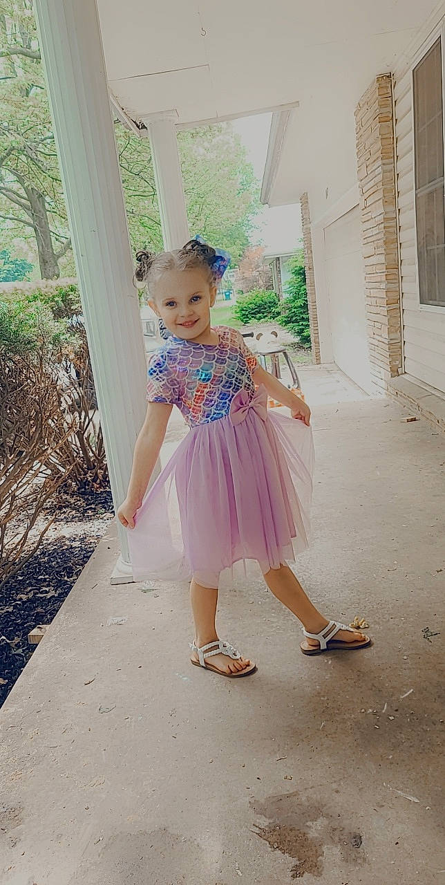 Lila joined the competition — help win amazing prizes! baby_toddler_clothing, day_dress, dress, event, fashion_design, footwear, formal_wear, grass, happy, human_leg, joy, magenta, pattern, person, pink, plant, sandal, shoe, smile, street_fashion