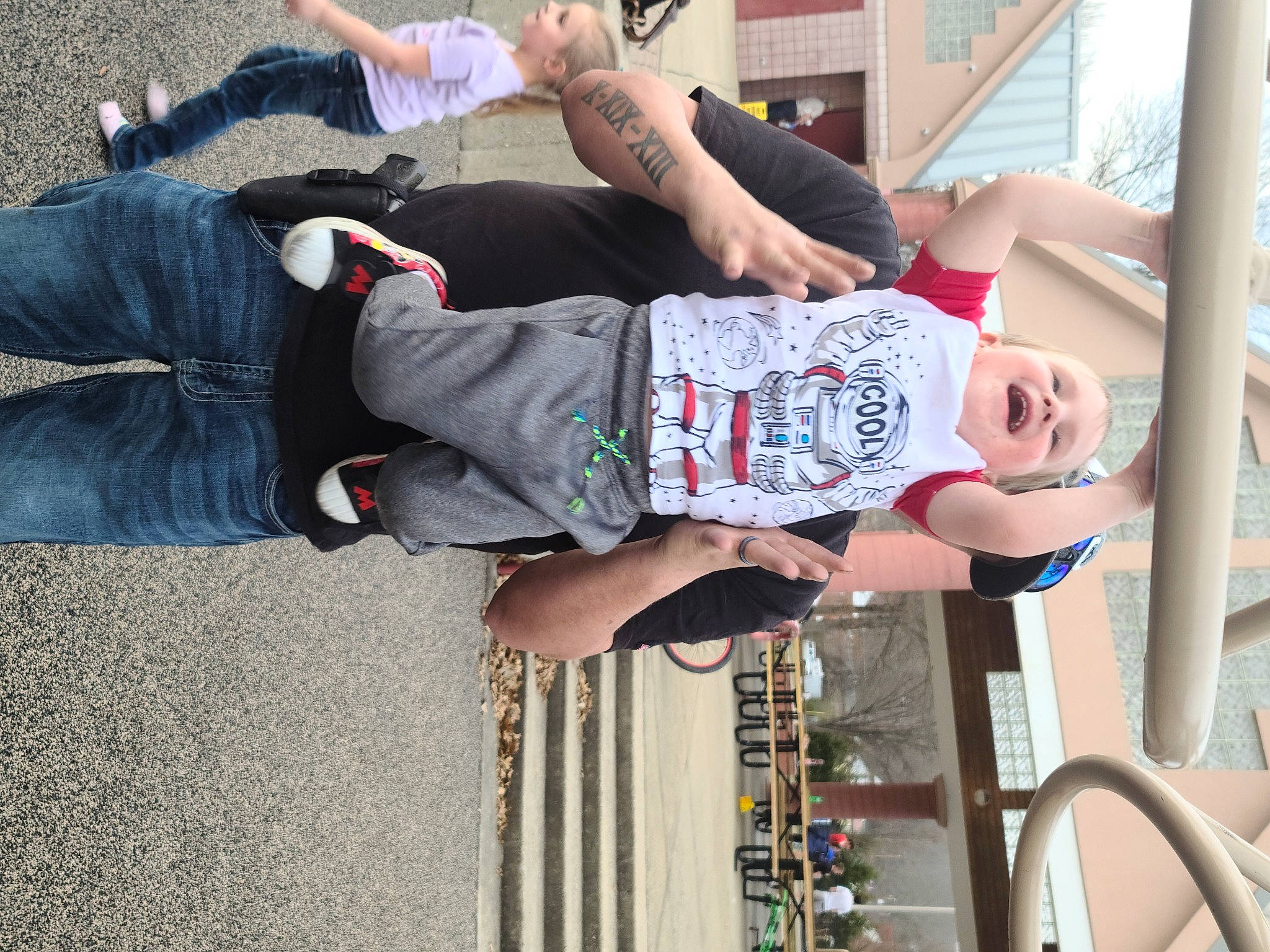 Carl is registered to the contest to win money with this photo: arm, child, fun, hand, human_leg, knee, leg, leisure, outdoor_shoe, person, recreation, shorts, sneakers, street_fashion, t_shirt, thigh, toddler, vertebrate, walking_shoe