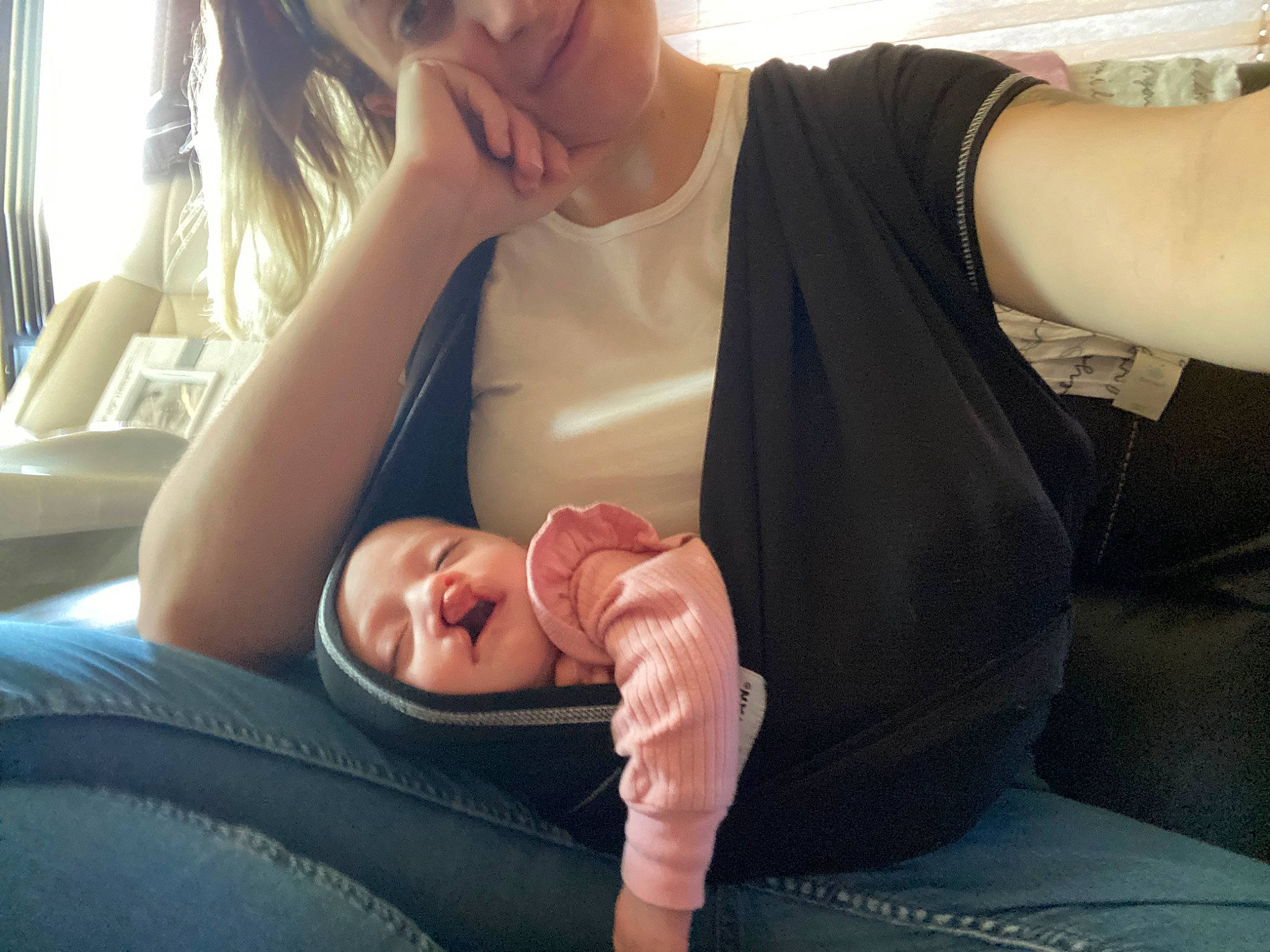 Blair is registered to the contest to win money with this photo: arm, baby, car_seat, child, comfort, elbow, finger, fun, gesture, hand, happy, human_leg, lap, mouth, nail, person, sitting, skin, smile, thumb