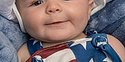 Finnley joined the competition — help win amazing prizes! baby, child, face, hat, white_hat, blue_eyes, smile, blanket, blue_blanket, stars_and_stripes, clothing, closeup, portrait, infant, cute, soft_texture, indoors, person, happy, young