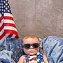 american_flag, baby, blanket, blue, child, clothing, cute, face, flag, head, indoor, infant, patriotic, person, portrait, serious, stars, stripes, sunglasses, tub