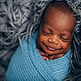 baby, newborn, smiling, wrapped, blanket, blue, fur, soft, peaceful, sleeping, portrait, cute, infant, closeup, cozy, tiny, child, resting, face, warm