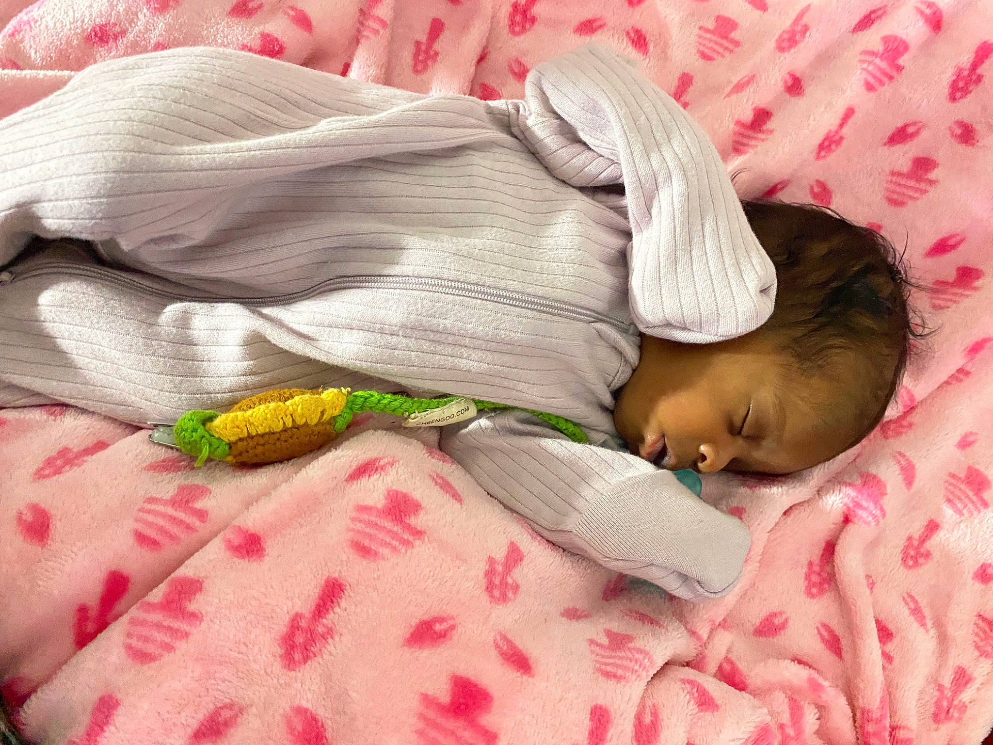 Zariah is registered to the contest to win money with this photo: baby, baby_products, baby_safety, baby_sleeping, baby_toddler_clothing, bed, bed_sheet, bedding, bedtime, child, comfort, infant_bed, linens, nap, pattern, person, pink, room, sleep, textile