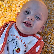 Huxley joined the competition — help win amazing prizes! baby, blue_eyes, child, closeup, corn, corn_kernels, cute, face, ghost, halloween, happy, holiday, infant, orange_clothing, outdoor, portrait, pumpkin, seasonal, smile, white_clothing