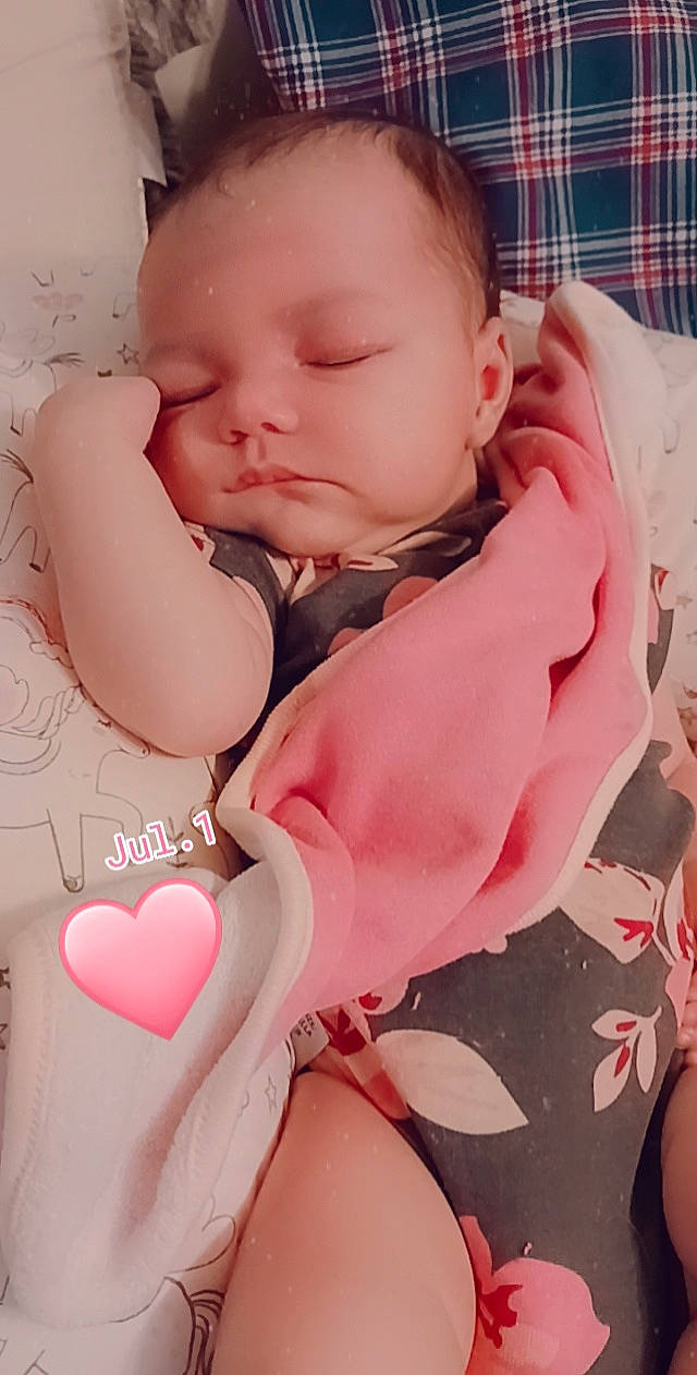 Luna is registered to the contest to win money with this photo: baby, baby_sleeping, baby_toddler_clothing, beauty, cheek, child, comfort, face, finger, happy, lip, muscle, neck, pattern, person, pink, skin, sleeve, stomach, toddler