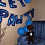 animal, appliance, architecture, balloon, building, canine, couch, dog, furniture, gun, indoors, livingroom, people, person, pet, poodle, puppy, room, text, weapon