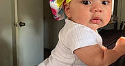 Jazzlyn joined the competition — help win amazing prizes! arm, baby, bonnet, child, clothing, colorful, curious, cute, door, face, hand, hat, indoors, infant, pattern, person, portrait, skin, strawberry, white_onesie