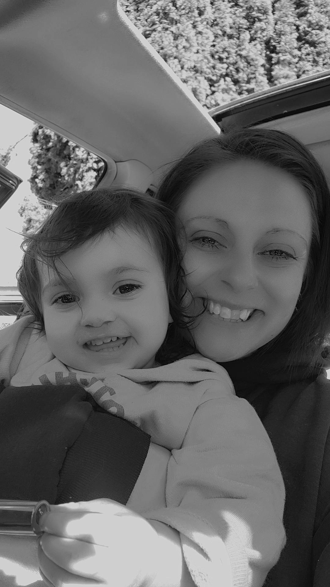 Jolene is registered to the contest to win money with this photo: black_and_white, child, event, facial_expression, fun, gesture, grass, happy, iris, joy, laugh, monochrome, monochrome_photography, people, people_in_nature, person, plant, selfie, smile, style