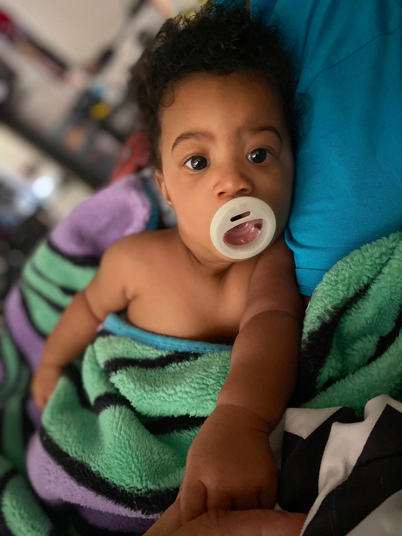 Mylo is registered to the contest to win money with this photo: abdomen, baby, baby_toddler_clothing, cheek, chest, chin, comfort, ear, eye, eyebrow, eyelash, face, finger, gesture, happy, iris, mouth, neck, nose, person