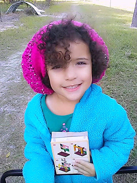 Audriana is registered to the contest to win money with this photo: child, joy, outerwear, person, pink, smile
