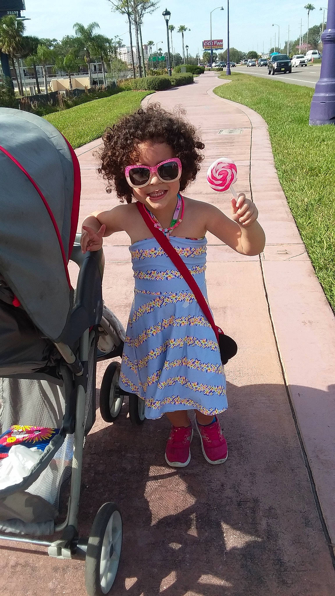 Audriana is registered to the contest to win money with this photo: baby_carriage, baby_products, eyewear, fun, joy, person, product, sunglasses