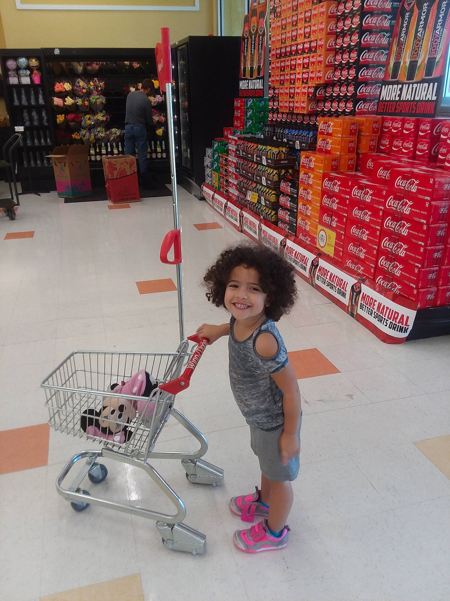 Audriana is registered to the contest to win money with this photo: child, floor, footwear, fun, joy, person, retail, shoe, shopping, supermarket, vehicle