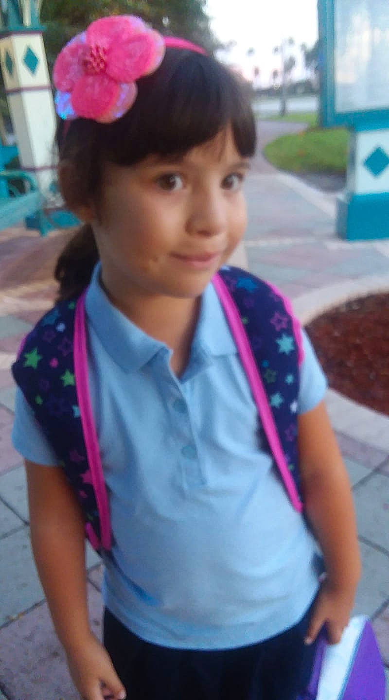 Isabella is registered to the contest to win money with this photo: black_hair, child, fashion_accessory, hair_accessory, headband, headgear, long_hair, neck, person, smile