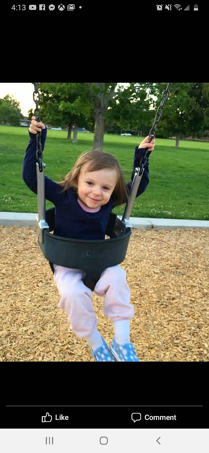Anastacia is registered to the contest to win money with this photo: joy, outdoor_play_equipment, person, playground, public_space, recreation, smile, swing