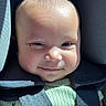 baby, baby_face, baby_smile, car_interior, car_seat, child, child_in_car_seat, closeup, cute, face, green_clothing, head, infant, infant_clothing, safety, seat, seatbelt, smile, straps, sunlight