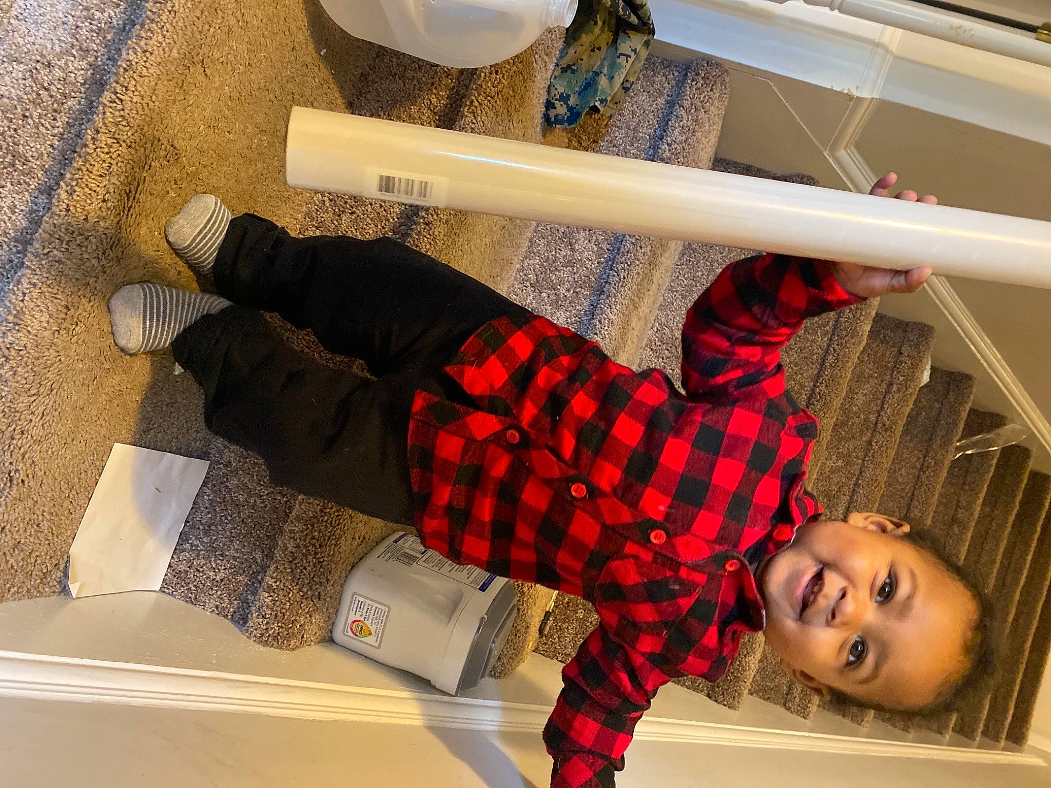 Larry is registered to the contest to win money with this photo: bed, comfort, floor, flooring, happy, human_leg, joy, knee, linens, pattern, person, plaid, shelf, sleeve, smile, sock, sunglasses, t_shirt, tartan, thigh