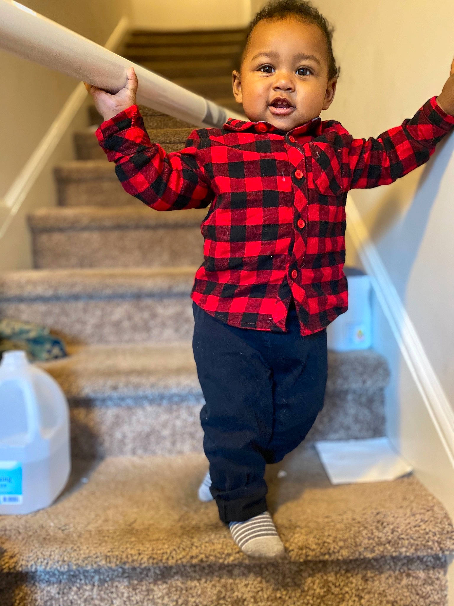 Larry joined the competition — help win amazing prizes! baby_toddler_clothing, blue, eye, face, floor, fun, gesture, hair, happy, head, leg, person, plaid, shoulder, sleeve, smile, stairs, standing, t_shirt, tartan