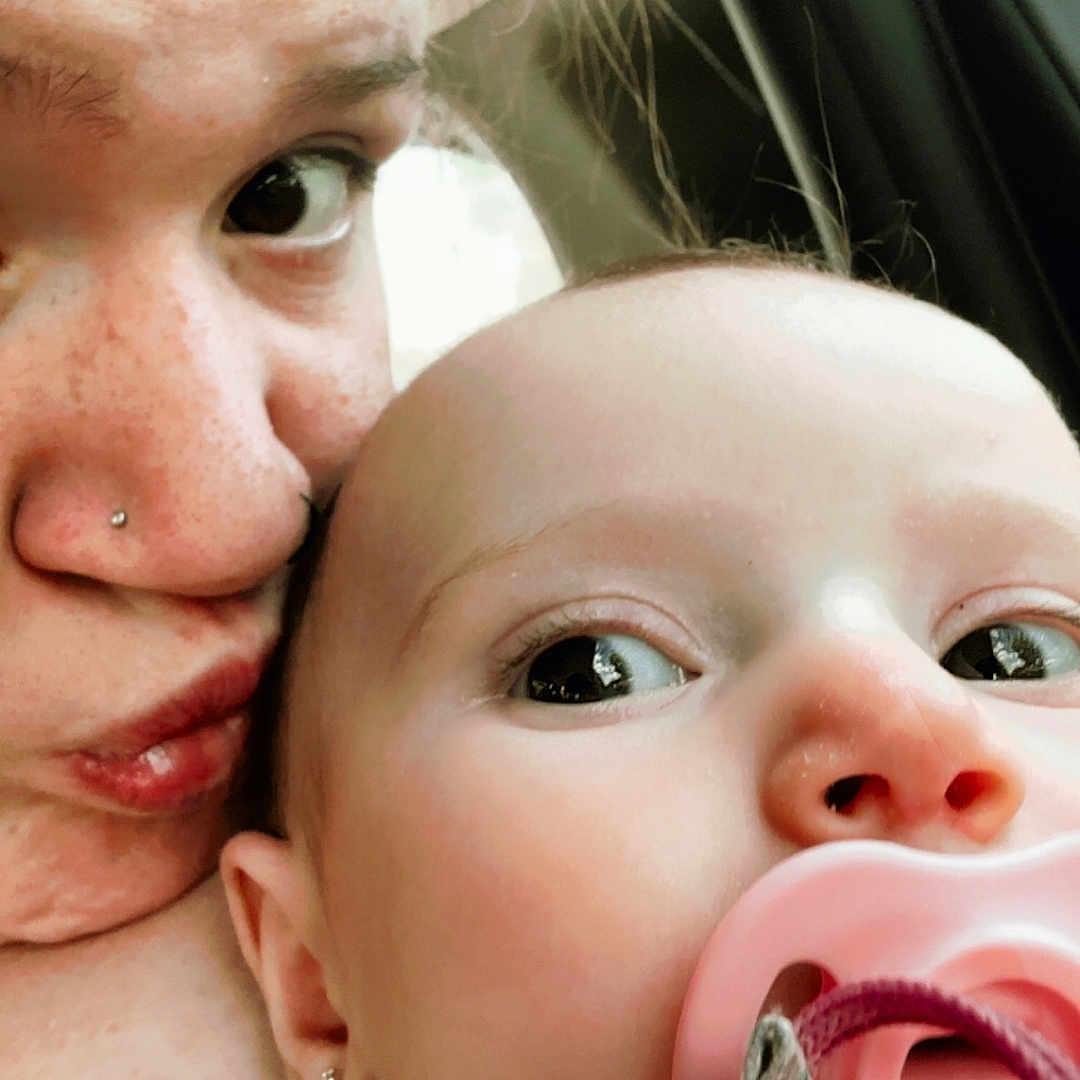 Vyla joined the competition — help win amazing prizes! baby, woman, face, close_up, pacifier, earring, nose_piercing, skin, expression, person, child, indoor, car, window, hair, cute, love, affection, portrait, casual
