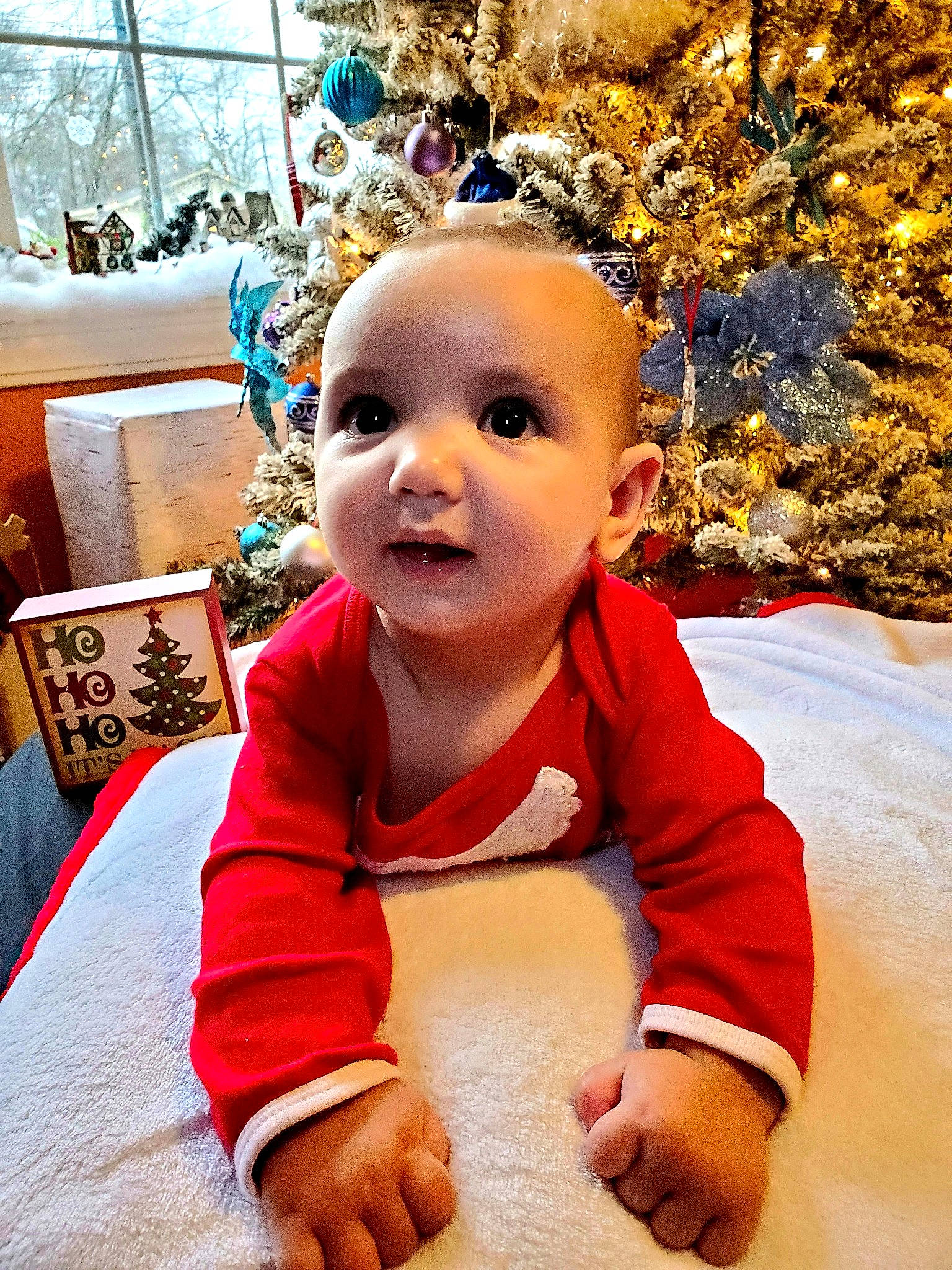 Elisha is registered to the contest to win money with this photo: baby, cheek, child, christmas, face, fun, happy, head, person, play, skin, smile, toddler, tree