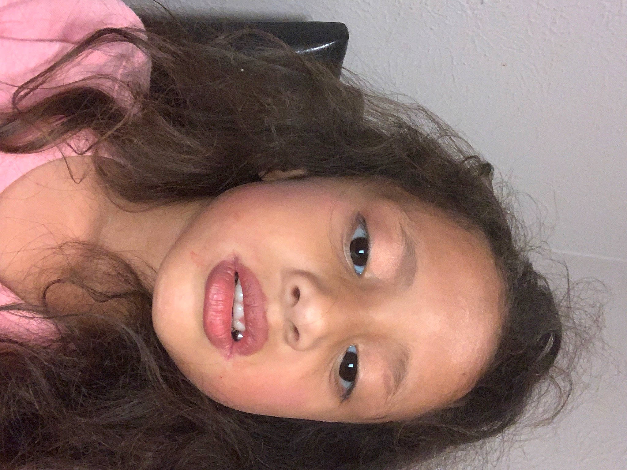 Genesis is registered to the contest to win money with this photo: black_hair, cheek, chin, cool, dress, ear, eyebrow, eyelash, facial_expression, flash_photography, forehead, iris, jaw, lip, mouth, neck, nose, person, plant, skin