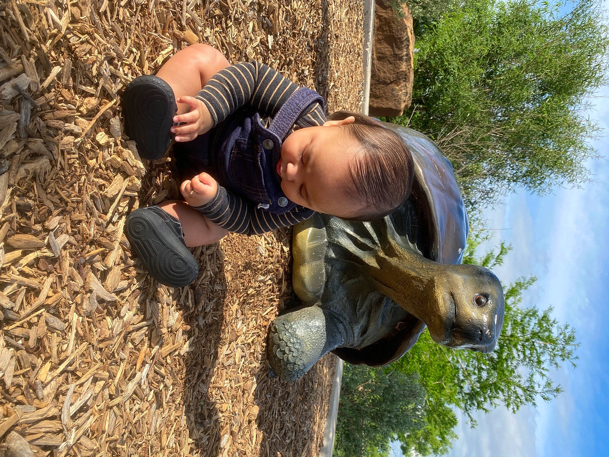 Jaydrien joined the competition — help win amazing prizes! art, boot, fun, grass, happy, landscape, leisure, people_in_nature, person, sculpture, shoe, sitting, sky, sneakers, soil, statue, tree, trunk, wildlife, wood