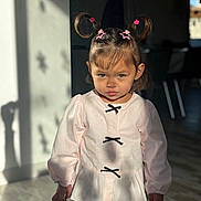 Summer a rejoint le concours — aidez-le/la à gagner de superbes lots ! child, girl, pigtails, hair_clips, pink_bows, long_sleeve_shirt, indoor, sunlight, shadow, floor, wood_floor, expression, serious, standing, person, clothing, face, portrait, cute, young