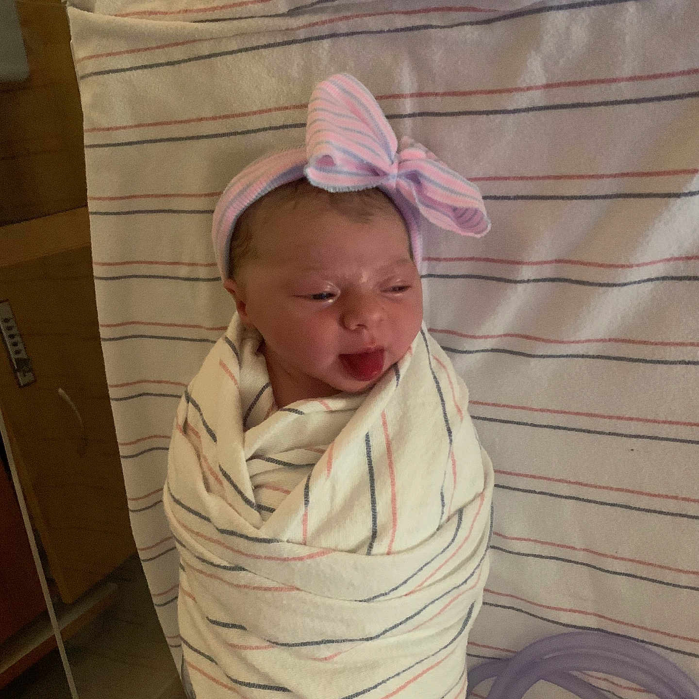 Rosalee Elaine is registered to the contest to win money with this photo: architecture, baby, bed, blanket, building, clothing, crib, face, furniture, hat, head, hospital, infantbed, newborn, person, photography, portrait, quilt, sleeping, towel