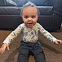 toddler, child, baby, carpet, couch, indoor, happy, smiling, clothing, long_sleeve, pants, sitting, person, home, living_room, cute, playful, expression, young, furniture