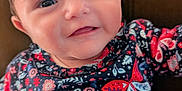 Eloyse participe au concours pour gagner de l'argent avec cette photo : baby, child, smiling, face, clothing, dress, pattern, butterfly, floral, red_bow, cute, portrait, infant, person, happy, indoors, seated, head, skin, young