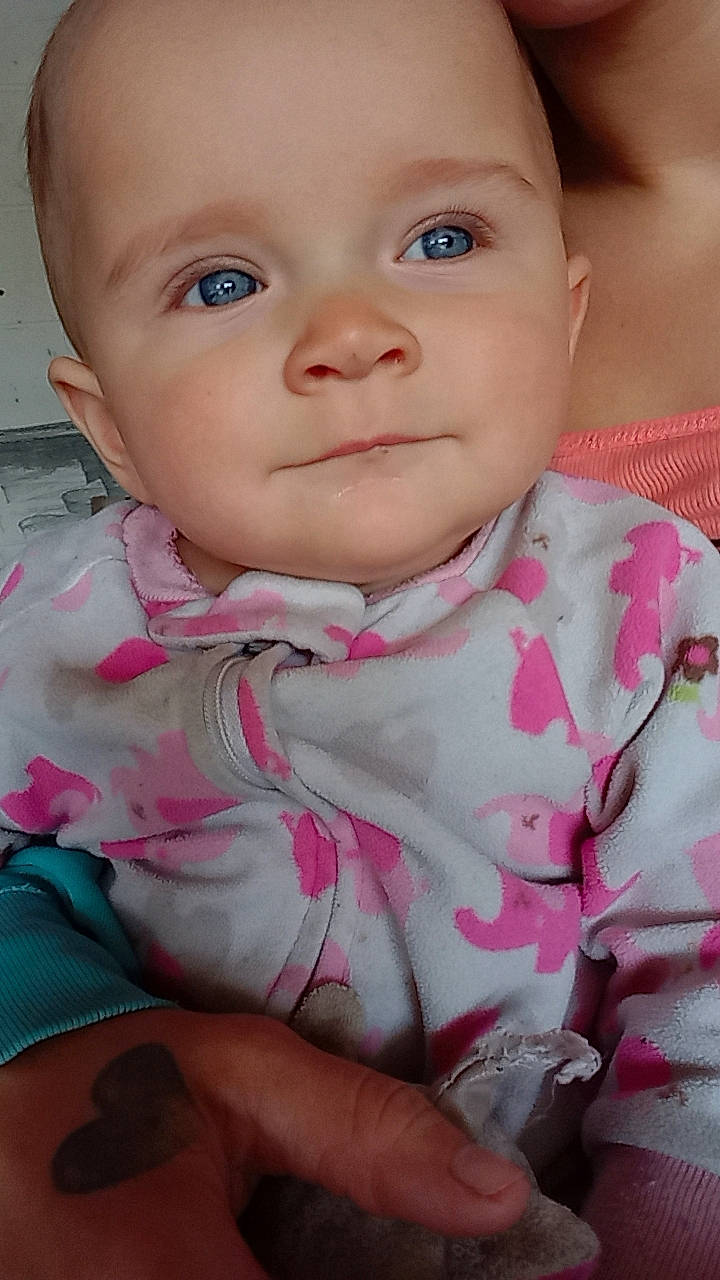 Serenity Ruth is registered to the contest to win money with this photo: baby, baby_products, baby_toddler_clothing, cheek, child, collar, dress, eye, eyelash, face, finger, happy, iris, lip, nose, pattern, person, pink, skin, sleeve