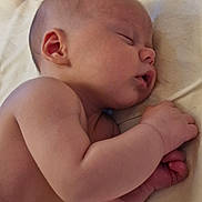 Cucumber is registered to the contest to win money with this photo: baby, sleeping, newborn, infant, skin, hand, ear, face, peaceful, rest, blanket, closeup, portrait, cute, child, toddler, nap, soft, human, relaxation