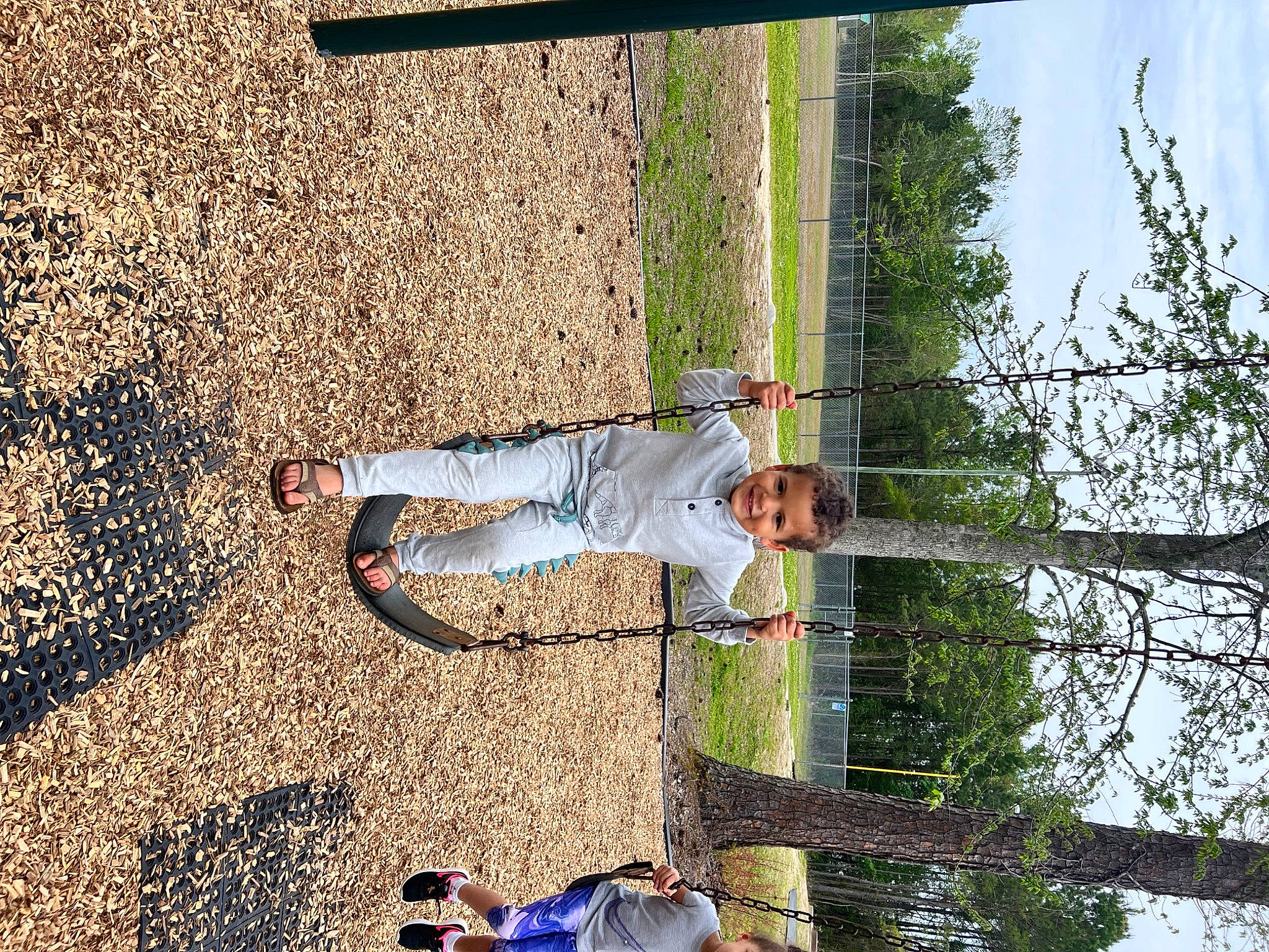 Blake is registered to the contest to win money with this photo: asphalt, concrete, fun, grass, joy, landscape, leisure, people_in_nature, person, plant, recreation, reflection, shadow, sky, soil, tints_and_shades, toddler, tree