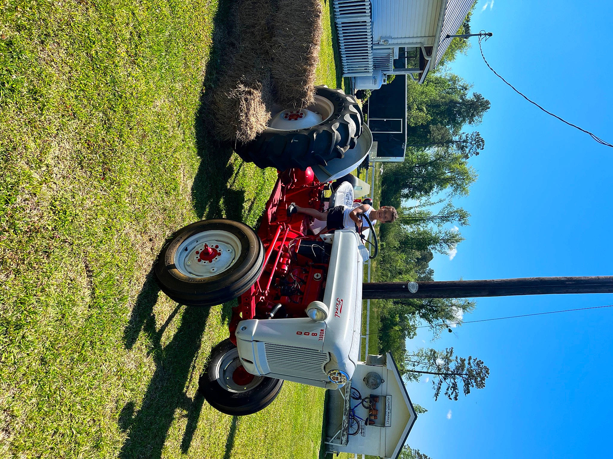 Blake is registered to the contest to win money with this photo: auto_part, automotive_tire, automotive_wheel_system, electricity, extreme_sport, grass, joy, leisure, machine, motor_vehicle, nature, person, plant, pole, public_utility, recreation, sky, sports, tire, tree