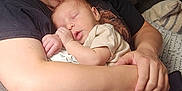 Rhett joined the competition — help win amazing prizes! woman, baby, sleeping, couch, blanket, glasses, indoor, comfort, love, tenderness, holding, casual_clothing, relaxing, home, person, child, face, arm, peaceful, curtains