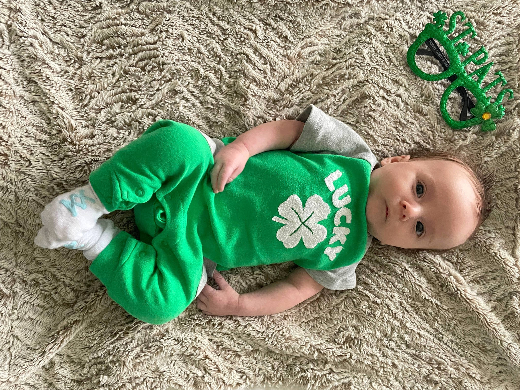 Kenneth is registered to the contest to win money with this photo: baby, baby_toddler_clothing, child, foot, fun, grass, happy, head, human_leg, leaf, leg, people_in_nature, person, sleeve, sock, soil, sportswear, t_shirt, thigh, toddler