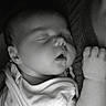 baby, sleeping, infant, closeup, face, arm, clothing, person, rest, peaceful, newborn, black_and_white, portrait, soft_light, tender, care, comfort, human, skin, quiet