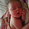 Aurora is registered to the contest to win money with this photo: baby, sleeping, blanket, floral, infant, peaceful, soft, cute, child, resting, skin, hand, face, indoors, portrait, newborn, comfort, cozy, nap, wrapped
